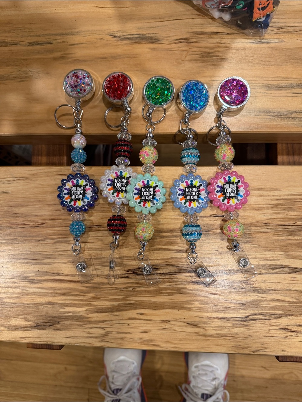 Beaded Badge Reel Keychain - Multicolor Flower, “No One Fights Alone,”